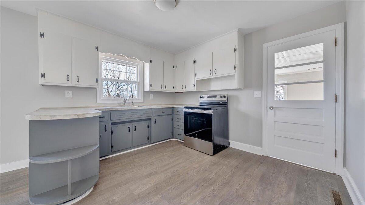 200 Cornell Road Rocky Mount, VA 24151 - Photo 5 of 44 a kitchen with white cabinets and sink