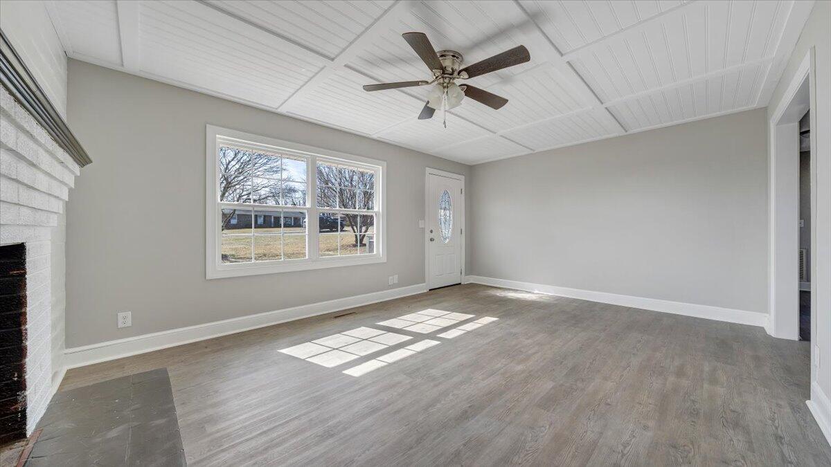 200 Cornell Road Rocky Mount, VA 24151 - Photo 6 of 44 a view of an empty room with a window and wooden floor