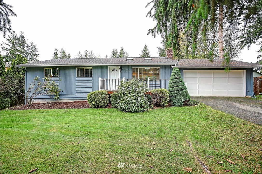 4415 212th Street Southeast Bothell, WA 98021 - Photo 1 of 29 a house that has a tree in front of it