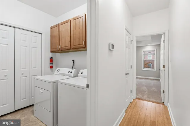 a view of a storage & utility room with a washer dryer