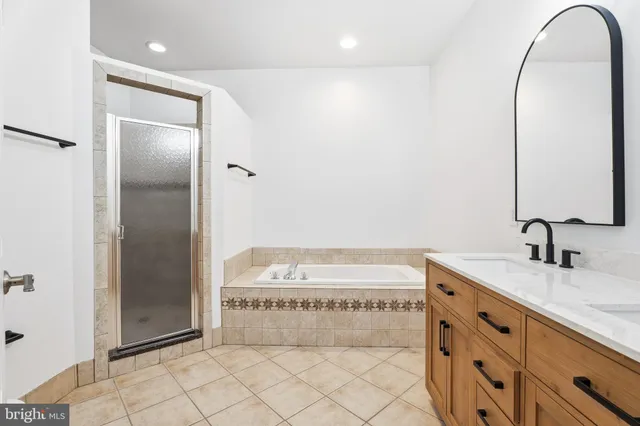 a bathroom with a sink a vanity and a mirror