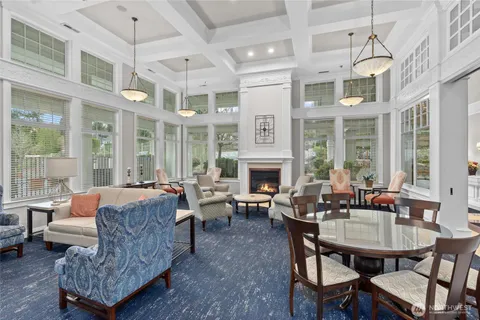 a kitchen with granite countertop a stove a sink and a microwave