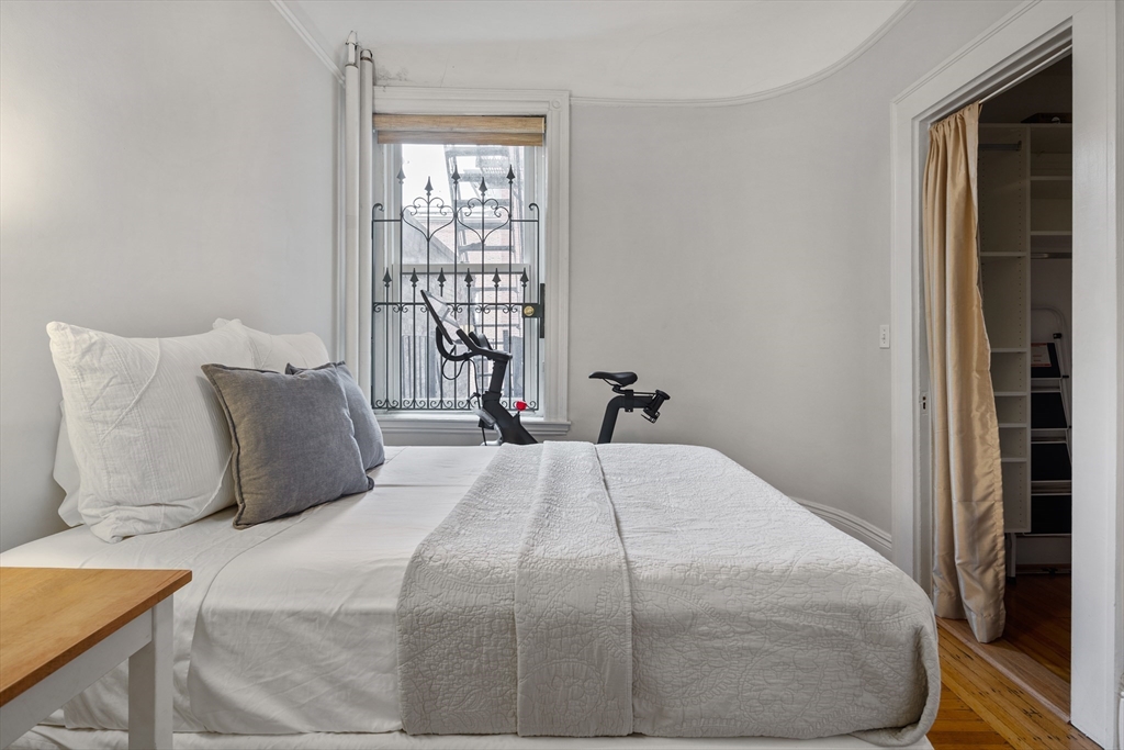 362 Commonwealth Avenue, Unit 4A Boston, MA 02115 - Photo 17 of 23 a bedroom with a bed and window