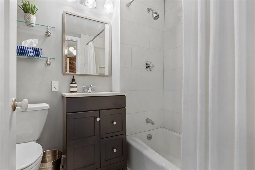 362 Commonwealth Avenue, Unit 4A Boston, MA 02115 - Photo 18 of 23 a bathroom with a sink a toilet and shower