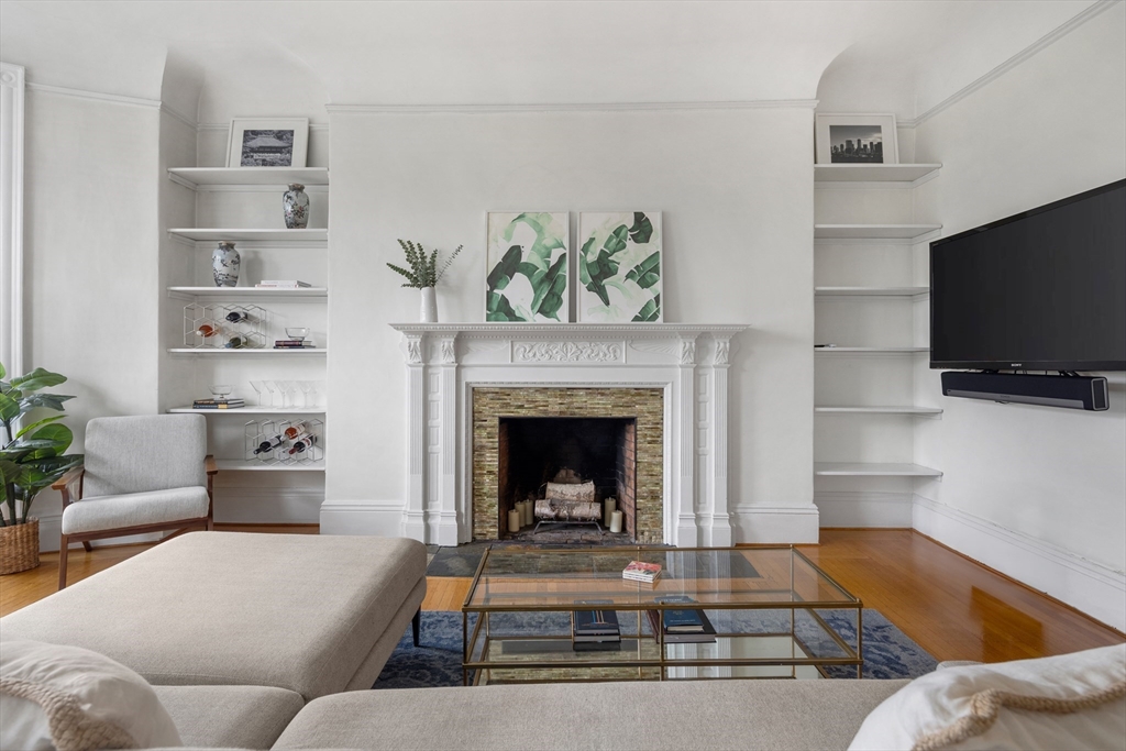 362 Commonwealth Avenue, Unit 4A Boston, MA 02115 - Photo 4 of 23 a living room with furniture and a fireplace