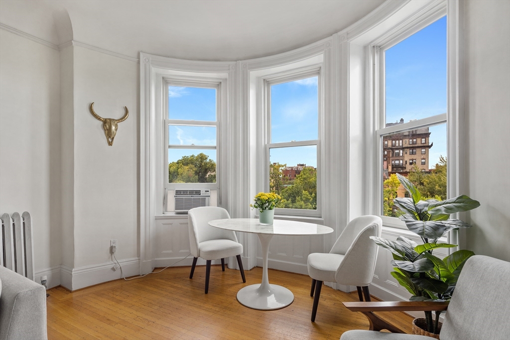 362 Commonwealth Avenue, Unit 4A Boston, MA 02115 - Photo 7 of 23 a view of a dining room with furniture and a window