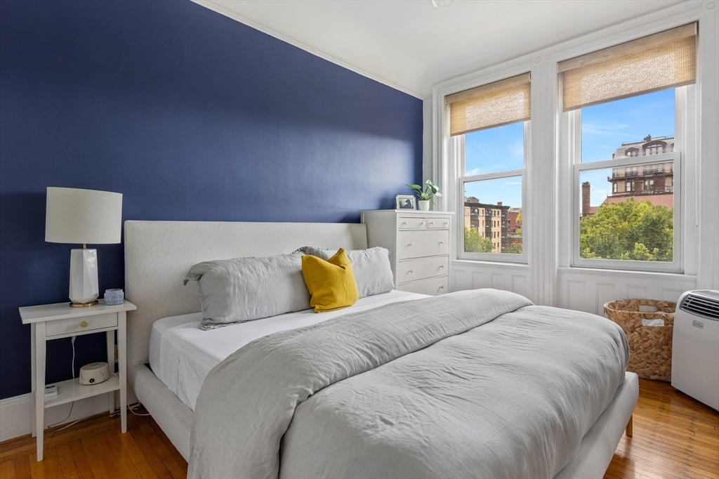 362 Commonwealth Avenue, Unit 4A Boston, MA 02115 - Photo 9 of 23 a bedroom with a bed and wooden floor