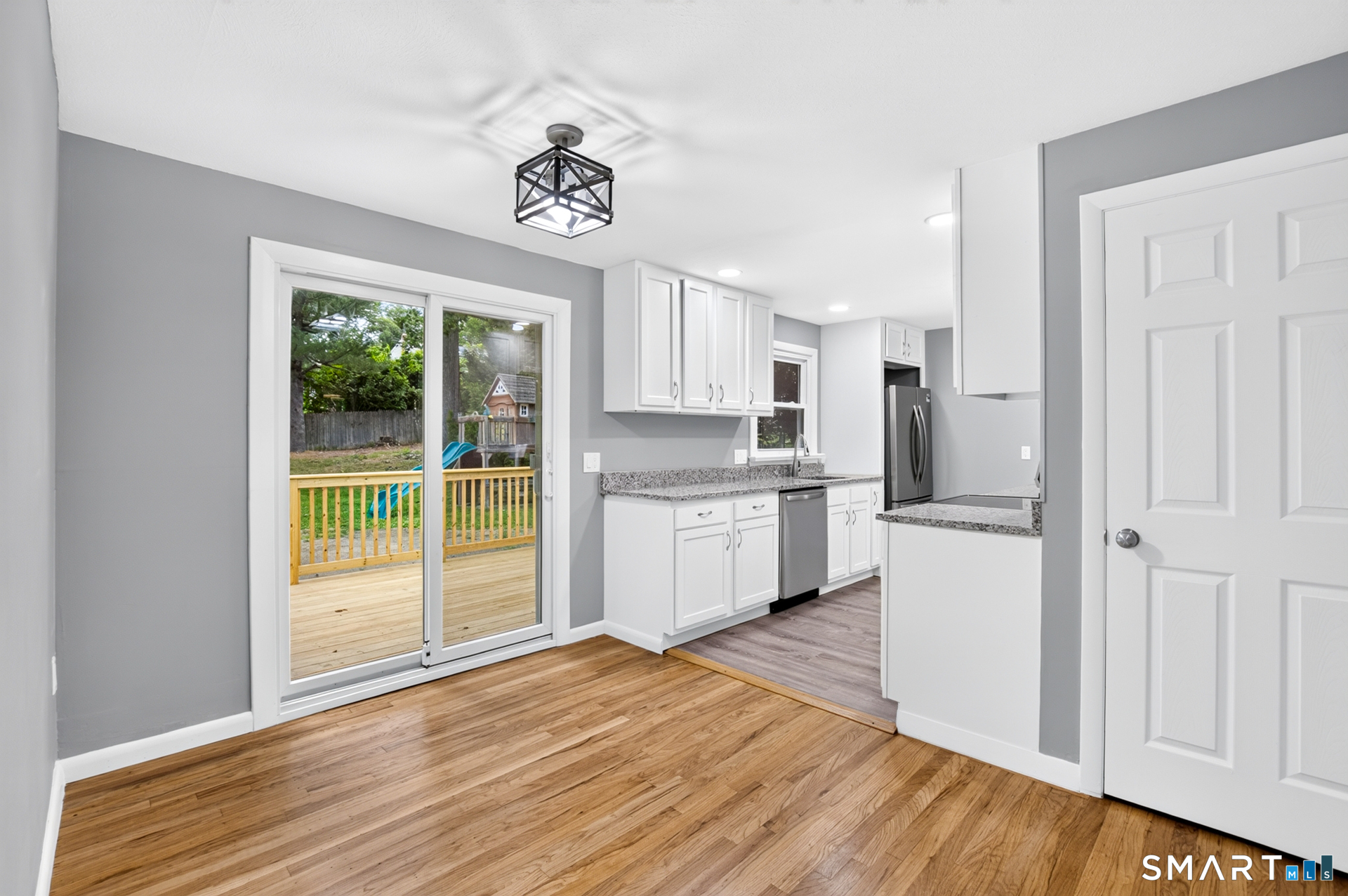 51 Beechwood Road Montville, CT 06370 - Photo 4 of 27 Dining Area with Deck Access & Open Flow to Kitchen