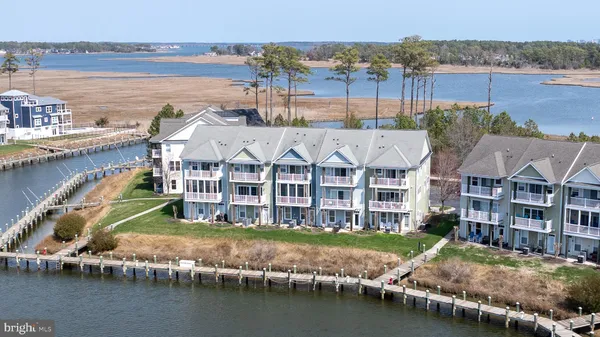an aerial view of a house with a lake view