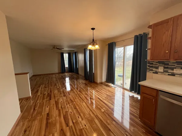 a spacious bathroom with a sink and a mirror