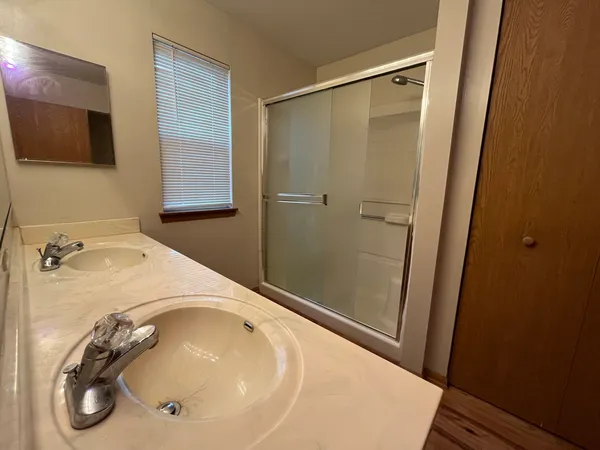 a bathroom with a tub and a sink