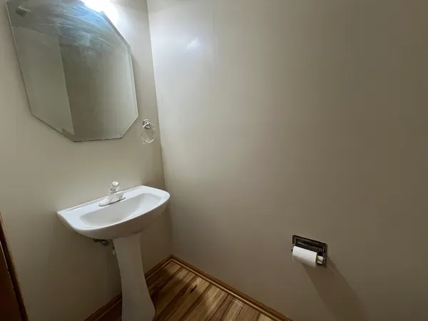 a bathroom with a sink and mirror
