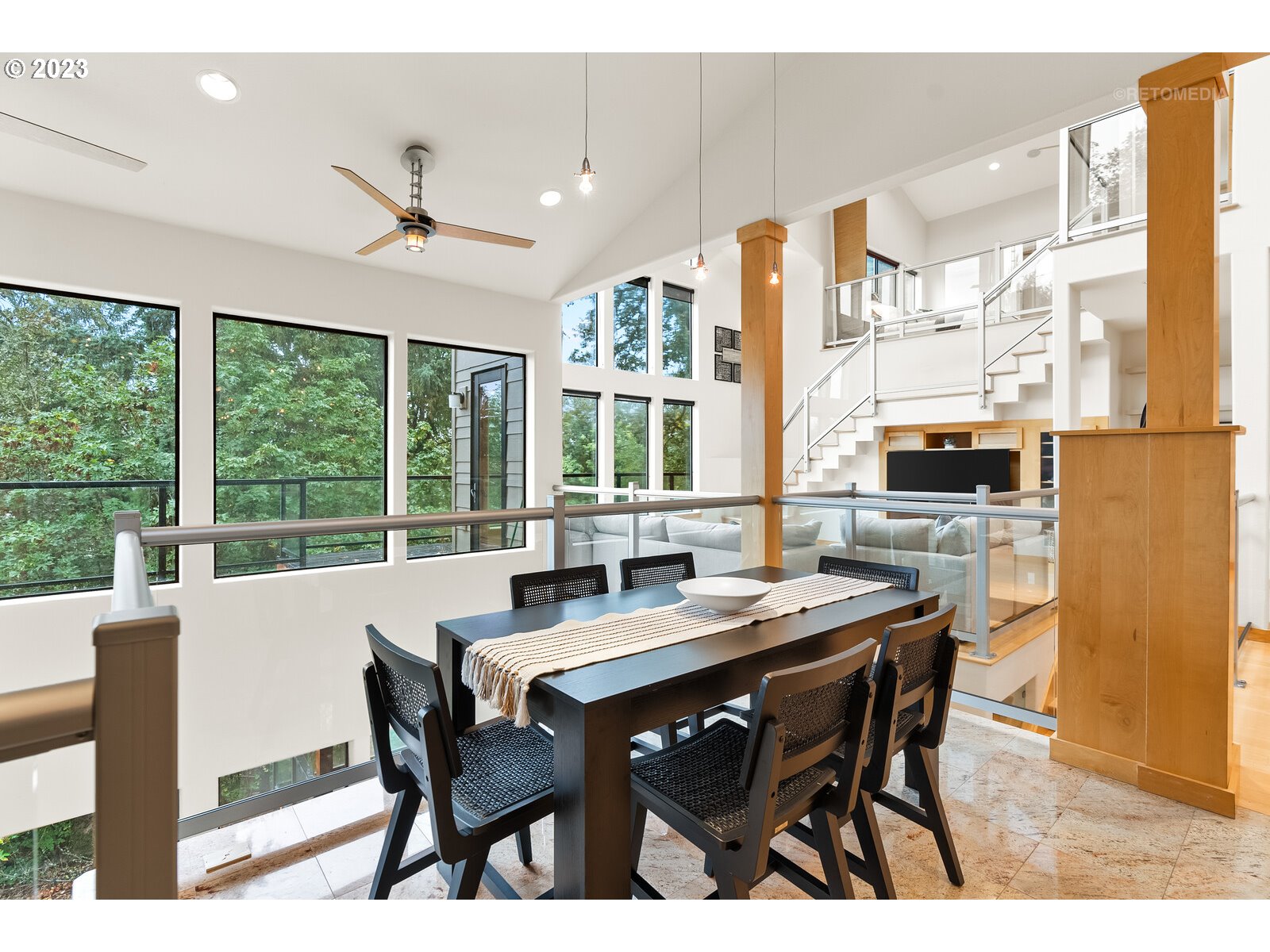 3236 Ridge Pointe Drive Forest Grove, OR 97116 - Photo 12 of 47 a view of a dining room with furniture large windows and wooden floor