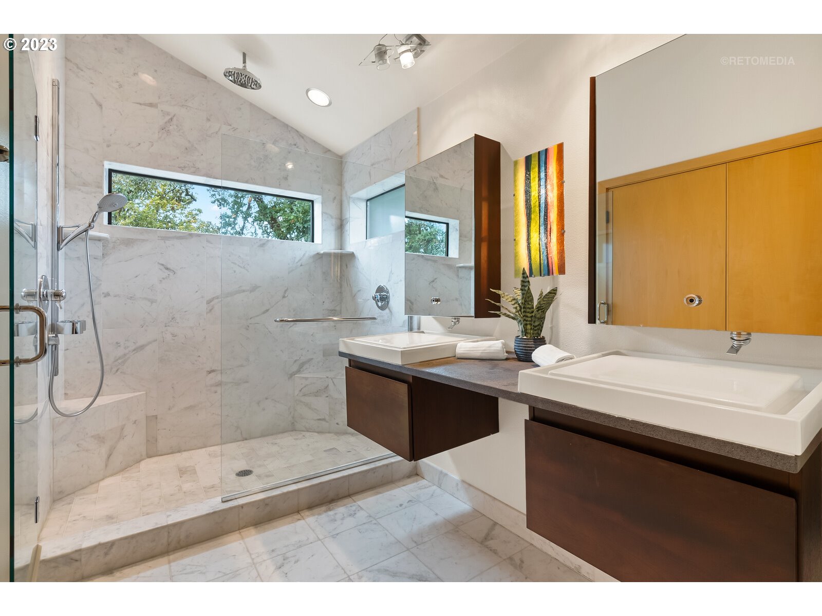 3236 Ridge Pointe Drive Forest Grove, OR 97116 - Photo 27 of 47 a bathroom with a double vanity sink a large mirror and shower