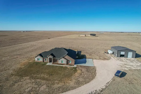 a view of a ocean with a building in the background