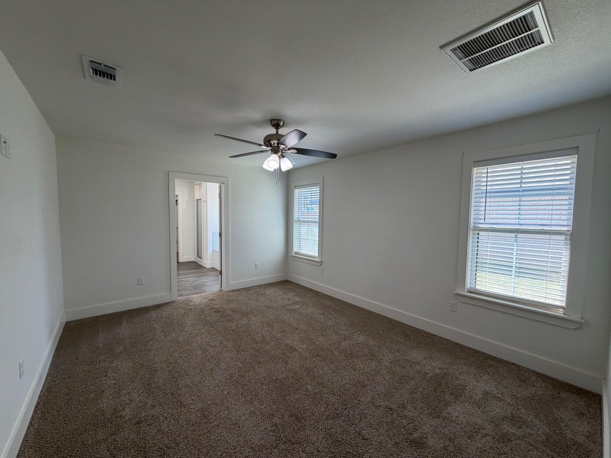 405 Ranger Street Wolfforth, TX 79382 - Photo 10 of 19 a view of an empty room with a window