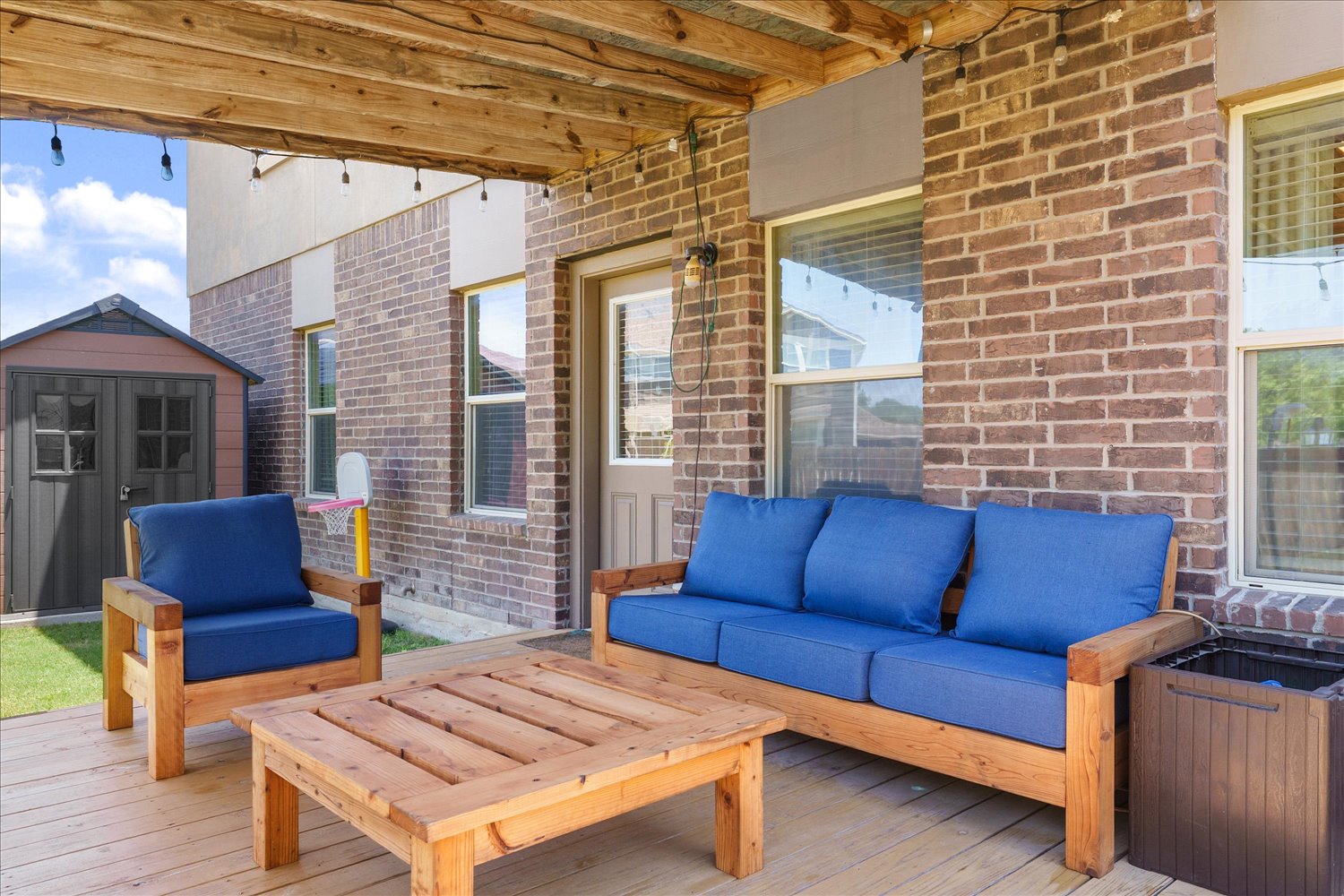 717 Kaluga Trail Leander, TX 78641 - Photo 25 of 40 a view of a patio with couches chairs and wooden floor