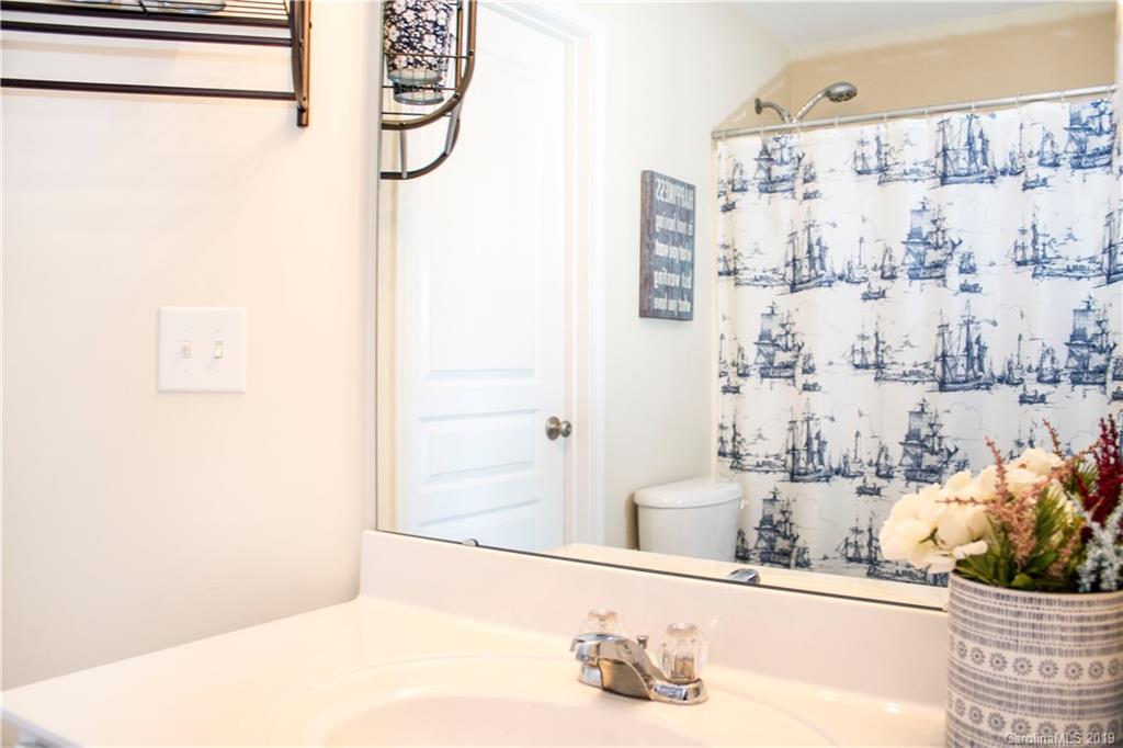 281 Sand Paver Way Fort Mill, SC 29708 - Photo 22 of 30 a bathroom with a sink and a mirror