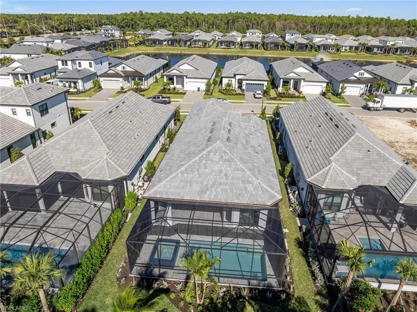 an aerial view of a tennis ground with large trees