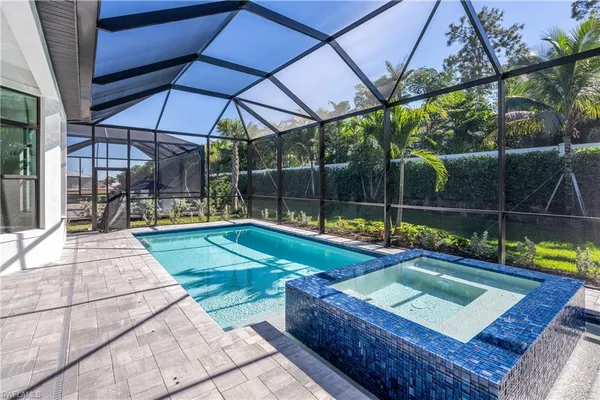 a view of an empty room with a floor to ceiling window