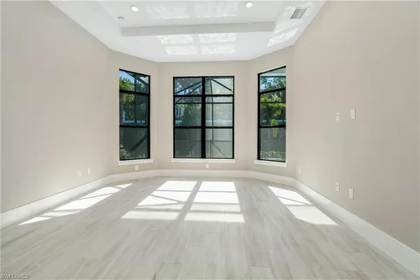 a view of a backyard with a patio and wooden floor