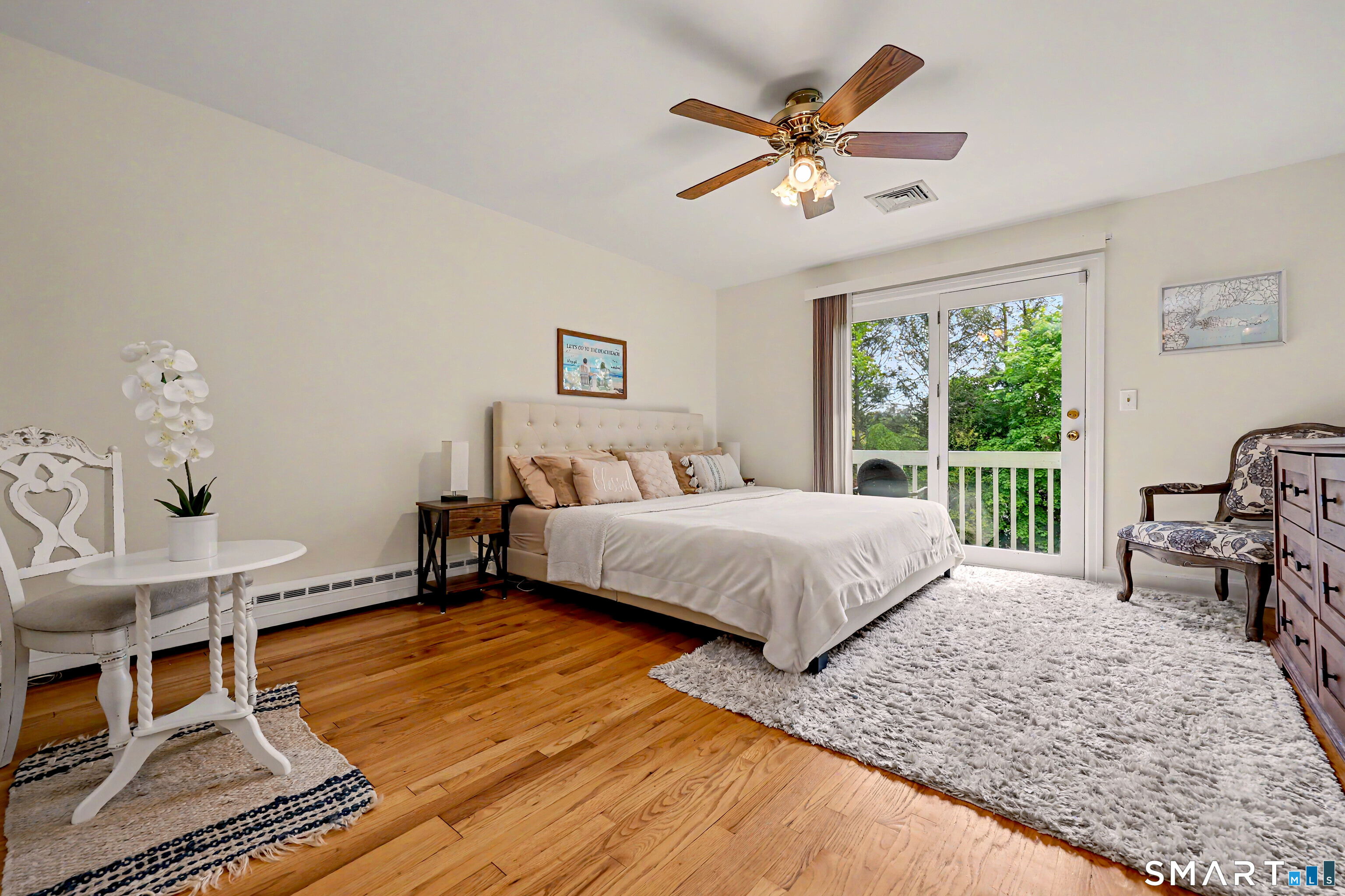 16 Ridgeland Circle Wallingford, CT 06492 - Photo 18 of 30 a bedroom with a large bed a chandelier and a window