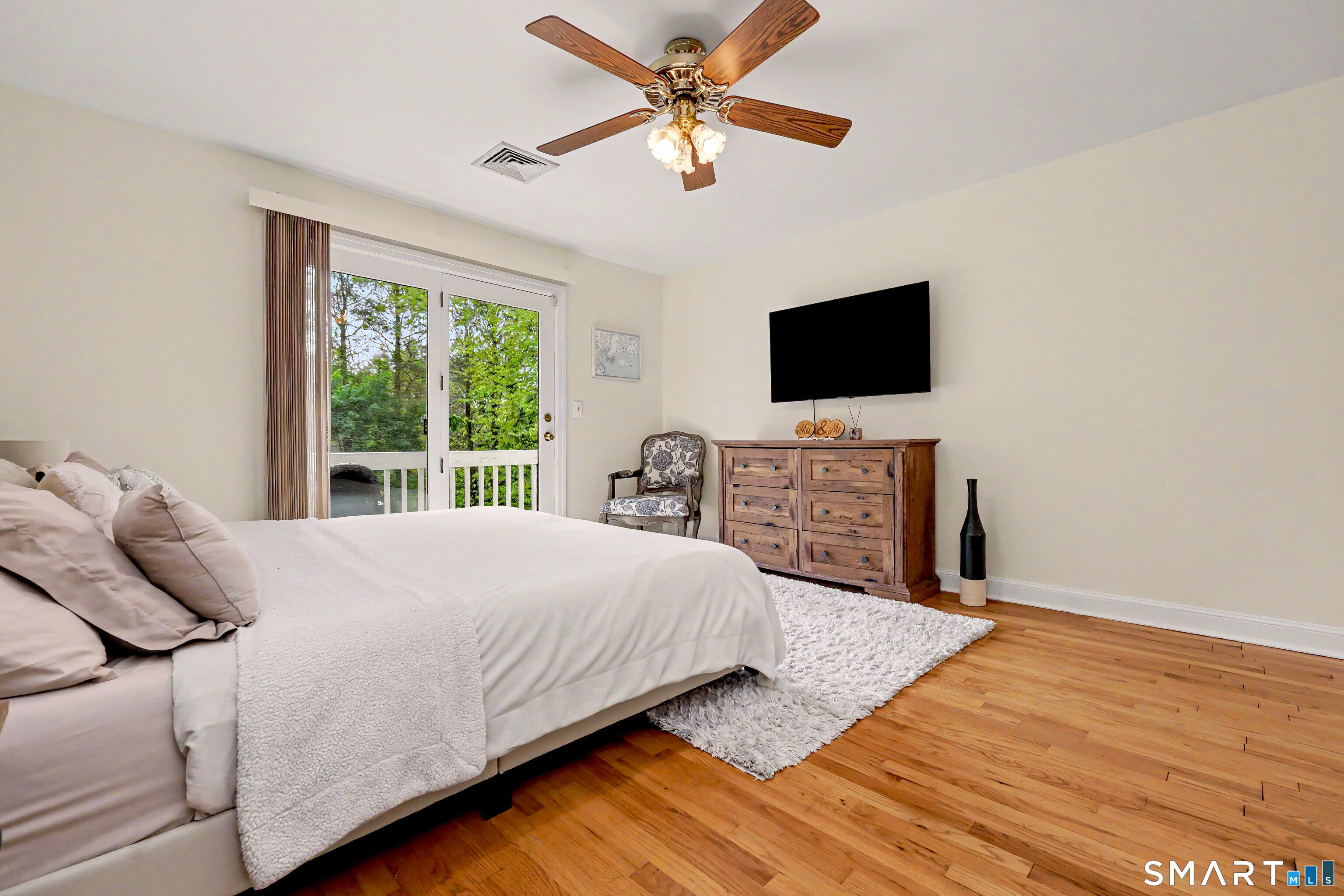 16 Ridgeland Circle Wallingford, CT 06492 - Photo 19 of 30 a bedroom with a bed and a flat screen tv