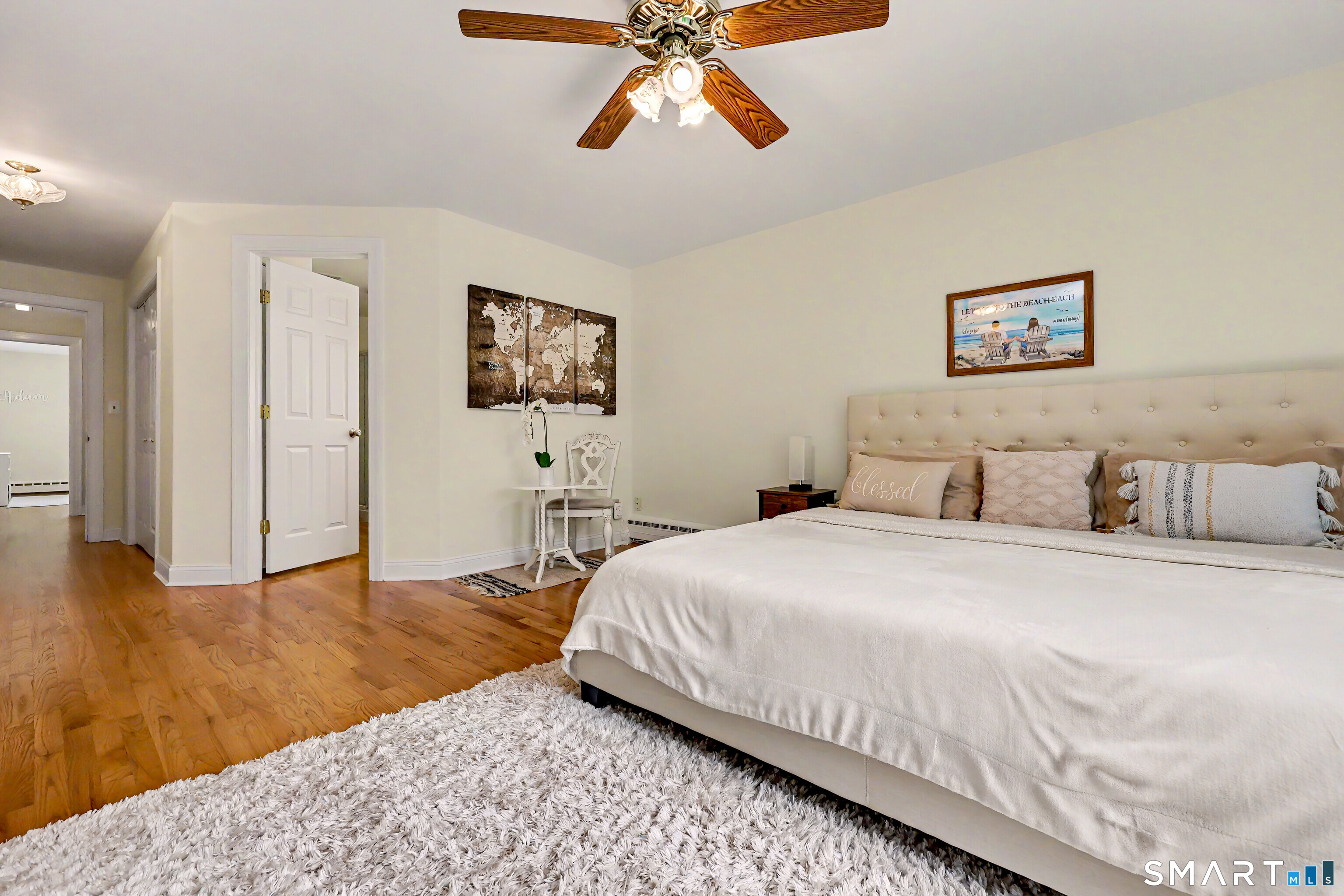 16 Ridgeland Circle Wallingford, CT 06492 - Photo 20 of 30 a bedroom with a bed and wooden floor