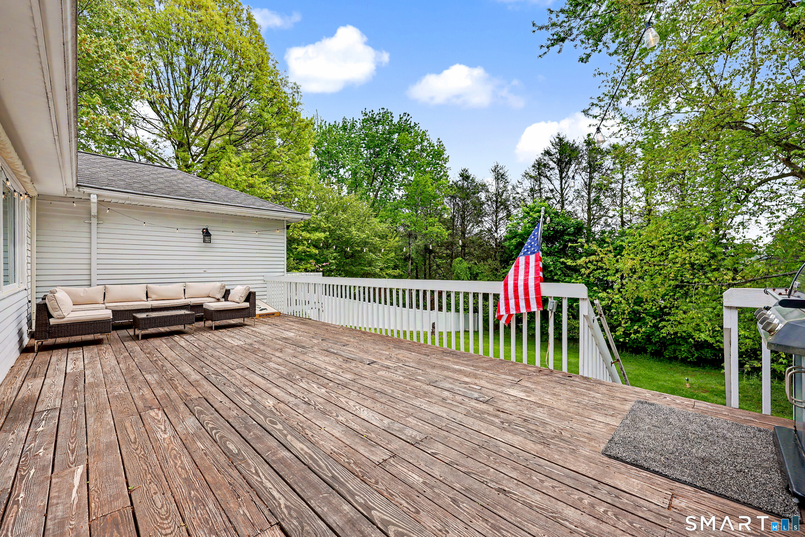 16 Ridgeland Circle Wallingford, CT 06492 - Photo 26 of 30 a view of a wooden deck and a yard