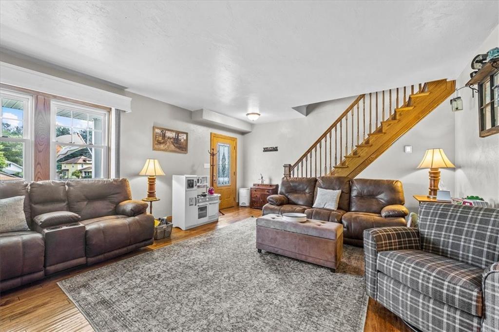 252 Old Plank Road Butler, PA 16002 - Photo 5 of 25 a living room with furniture ceiling fan and a rug