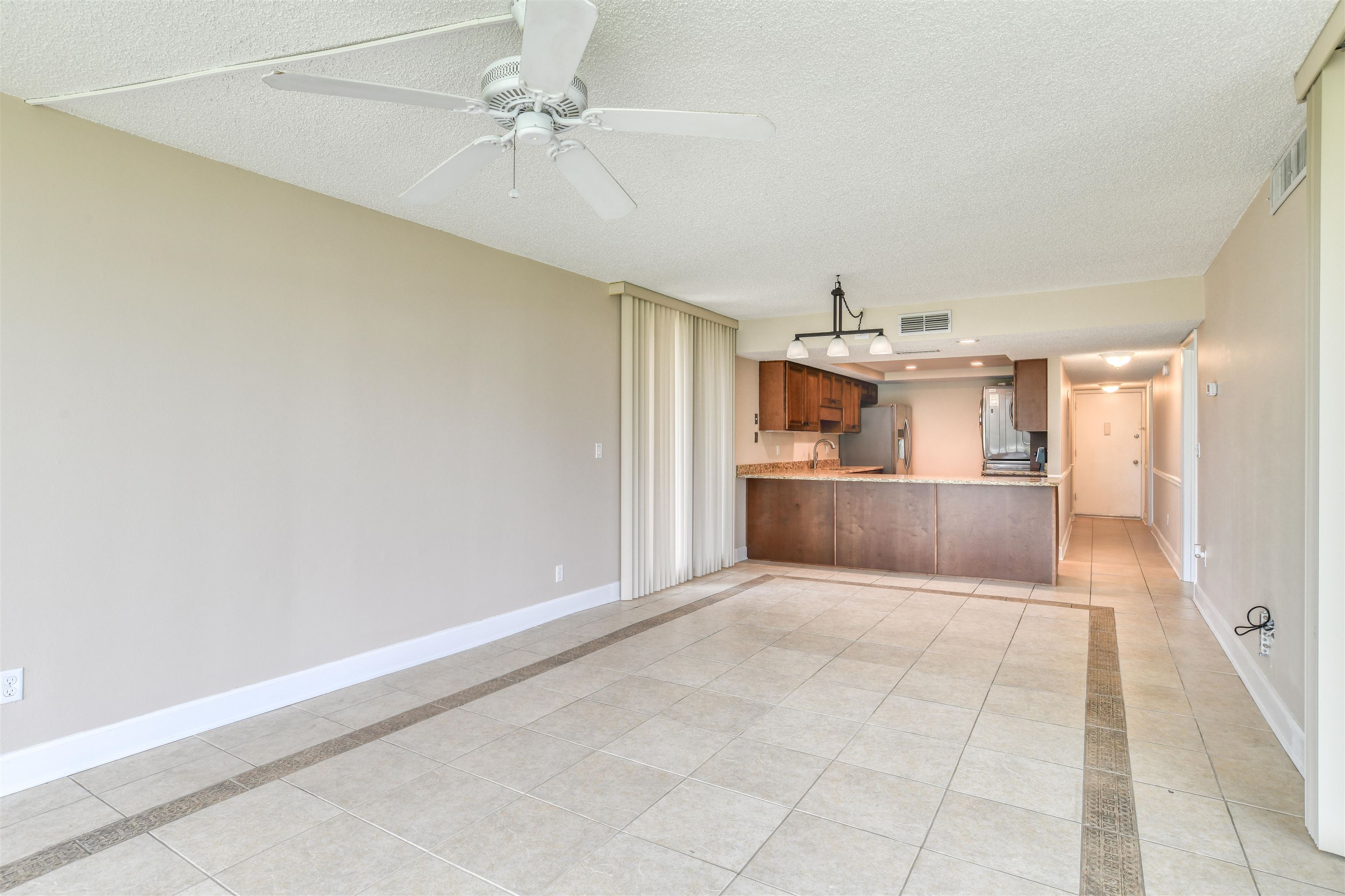 2 Dondanville Road, Unit 101 St. Augustine, FL 32080 - Photo 13 of 50 an empty room with cabinet and windows
