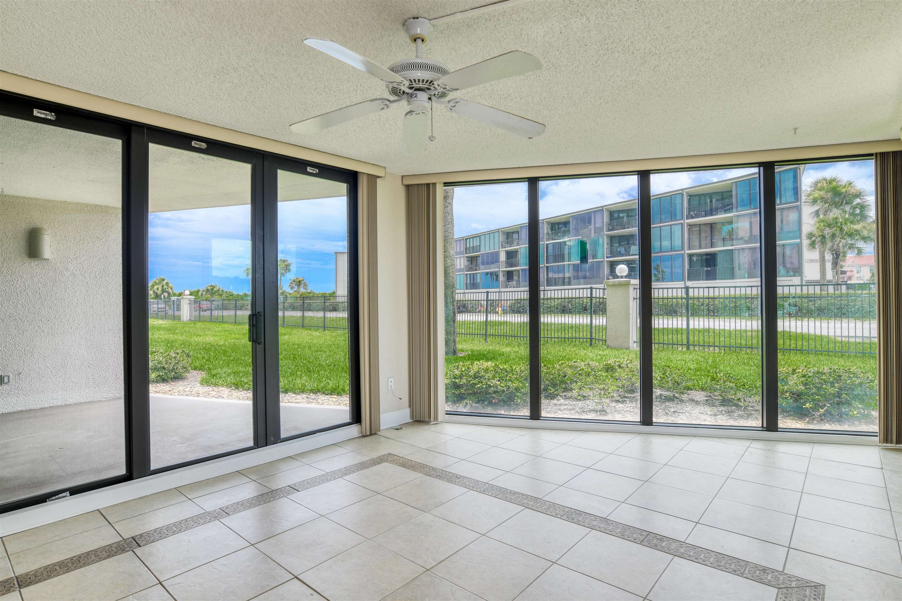2 Dondanville Road, Unit 101 St. Augustine, FL 32080 - Photo 16 of 50 a view of an empty room and window ceiling fan