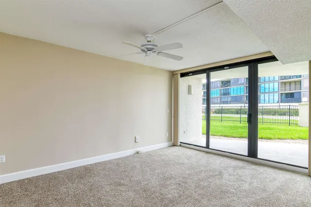 a view of an empty room with a window