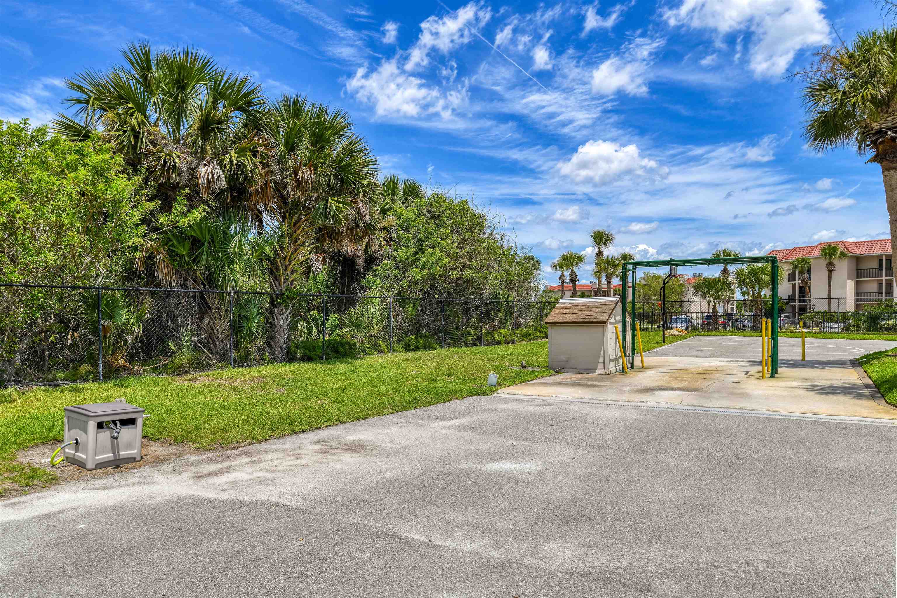 2 Dondanville Road, Unit 101 St. Augustine, FL 32080 - Photo 30 of 50 a view of a house with a big yard and potted plants