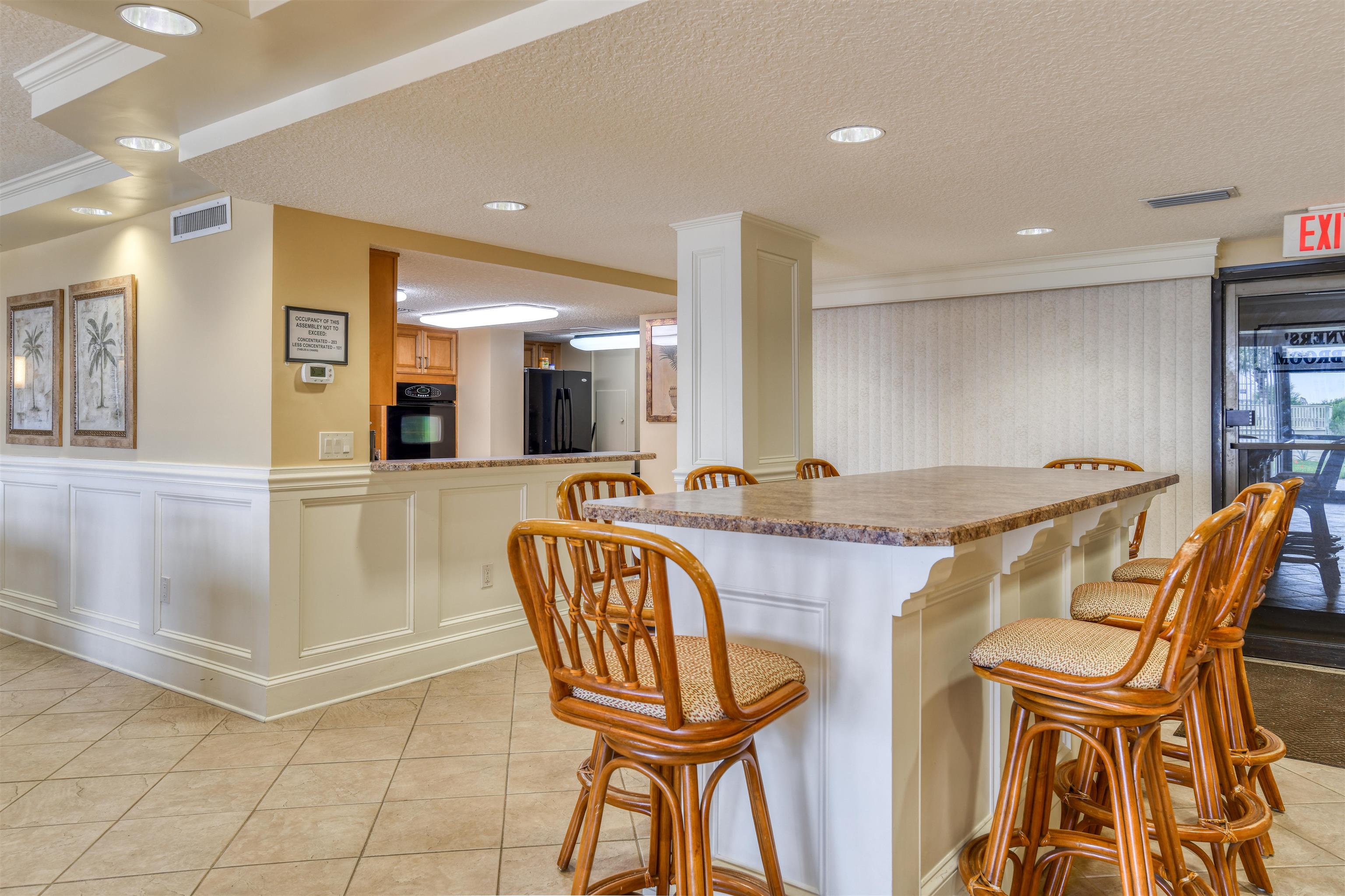 2 Dondanville Road, Unit 101 St. Augustine, FL 32080 - Photo 43 of 50 a bathroom with a granite countertop sink a mirror and a shower