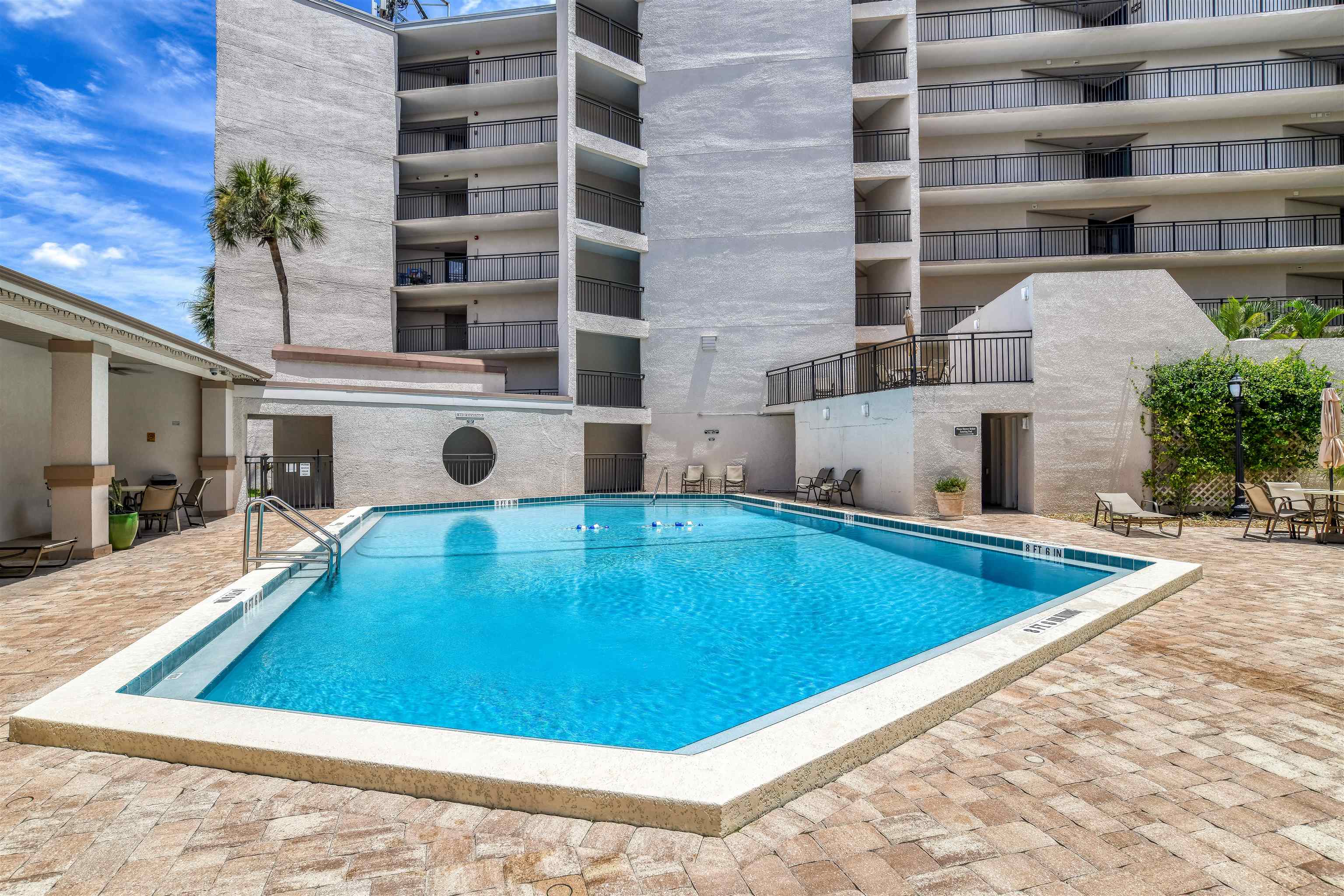 2 Dondanville Road, Unit 101 St. Augustine, FL 32080 - Photo 6 of 50 a view of a swimming pool with a lounge chairs