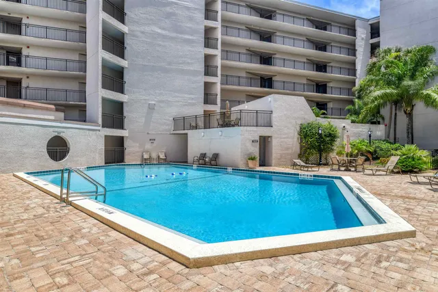 a view of swimming pool from a balcony