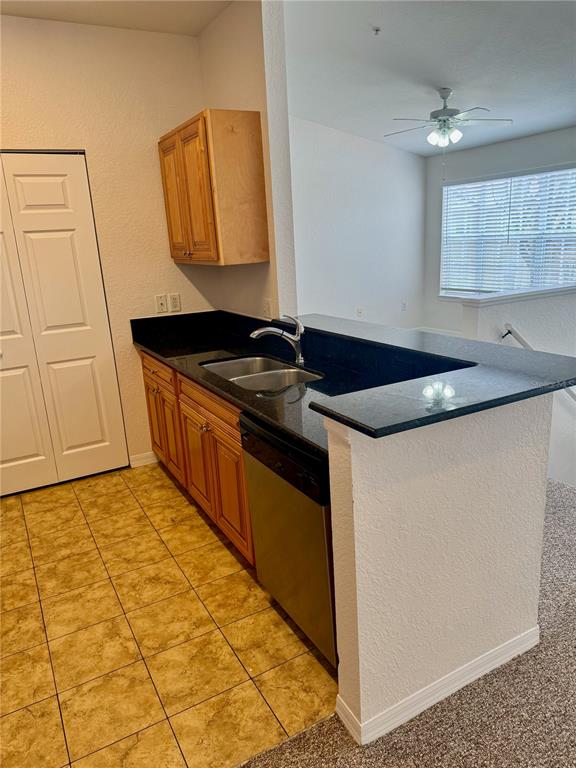832 Grand Regency Point, Unit 204 Altamonte Springs, FL 32714 - Photo 11 of 19 a kitchen with stainless steel appliances granite countertop a sink and cabinets