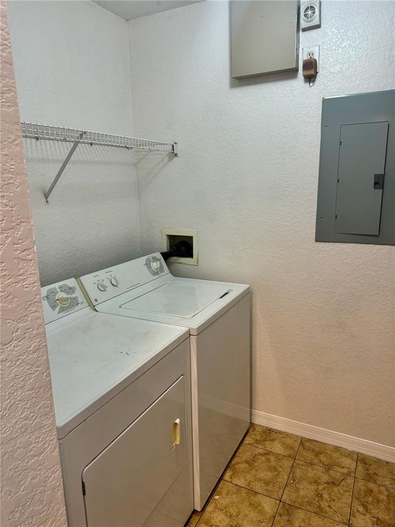 832 Grand Regency Point, Unit 204 Altamonte Springs, FL 32714 - Photo 12 of 19 a utility room with dryer and washer