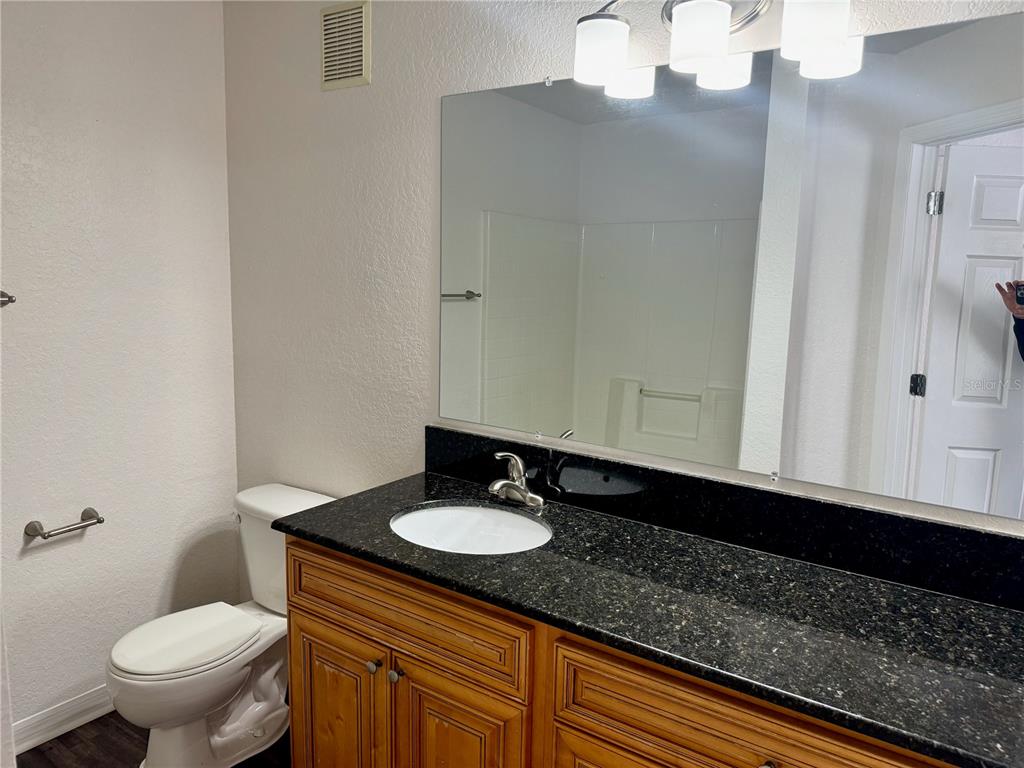 832 Grand Regency Point, Unit 204 Altamonte Springs, FL 32714 - Photo 14 of 19 a bathroom with a sink and a toilet