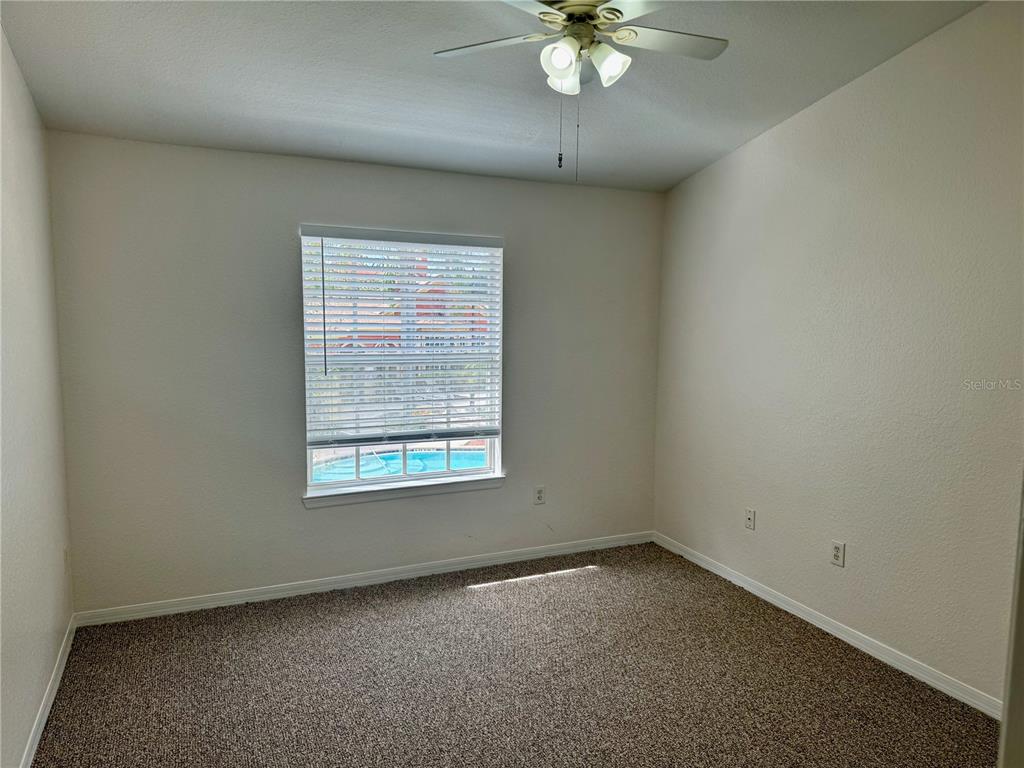 832 Grand Regency Point, Unit 204 Altamonte Springs, FL 32714 - Photo 17 of 19 an empty room with a window