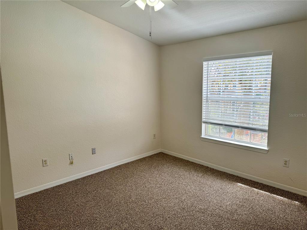 832 Grand Regency Point, Unit 204 Altamonte Springs, FL 32714 - Photo 18 of 19 an empty room with a window