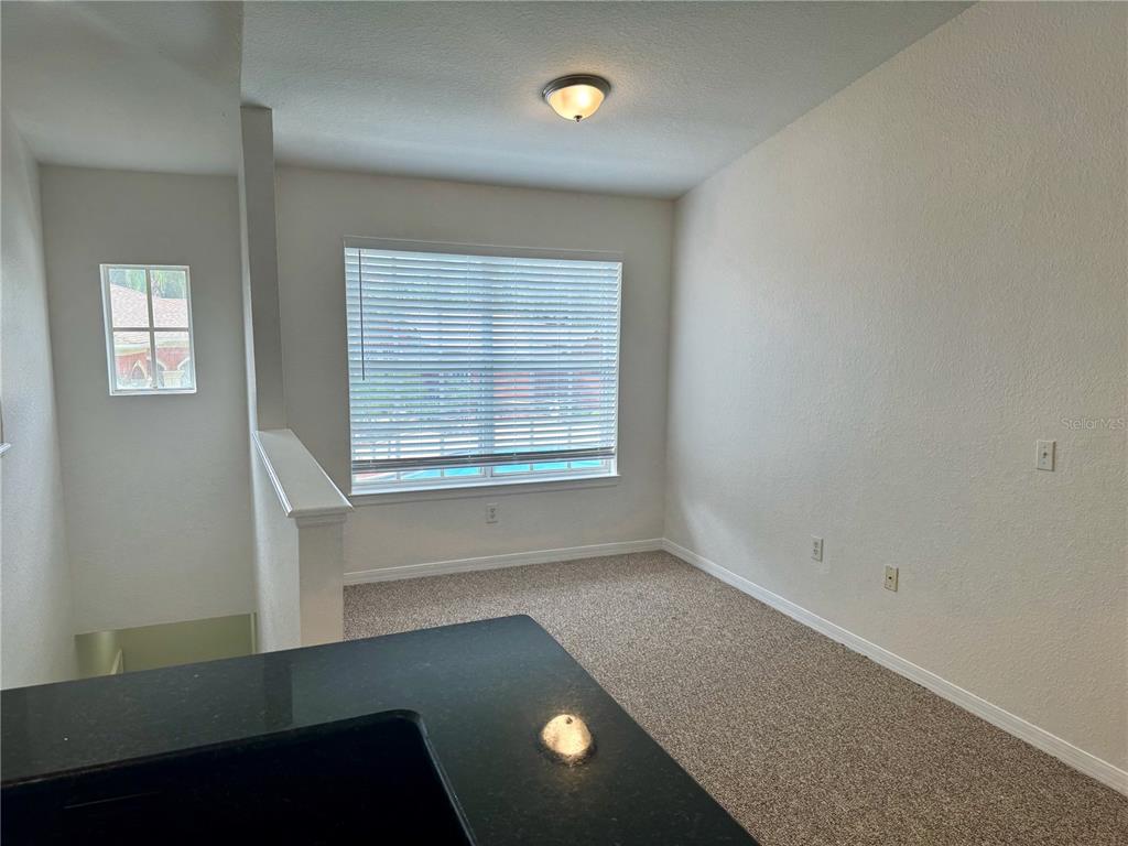 832 Grand Regency Point, Unit 204 Altamonte Springs, FL 32714 - Photo 5 of 19 an empty room with a window