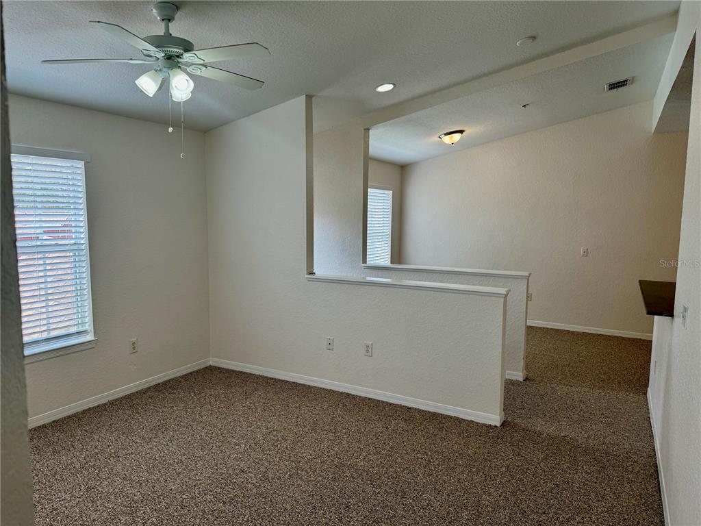 832 Grand Regency Point, Unit 204 Altamonte Springs, FL 32714 - Photo 6 of 19 a view of an empty room with a window