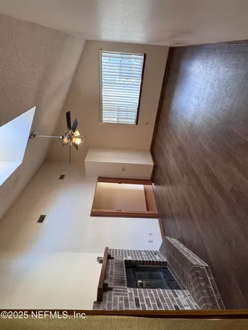 a view of an empty room and window