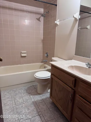 a bathroom with a sink and vanity