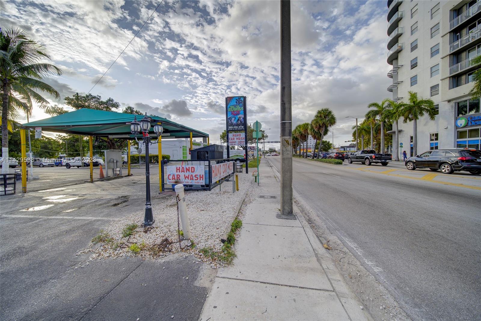 Car Wash For Sale In Miami Miami, FL 33125 - Photo 11 of 19 a view of a patio with a table and chairs under an umbrella