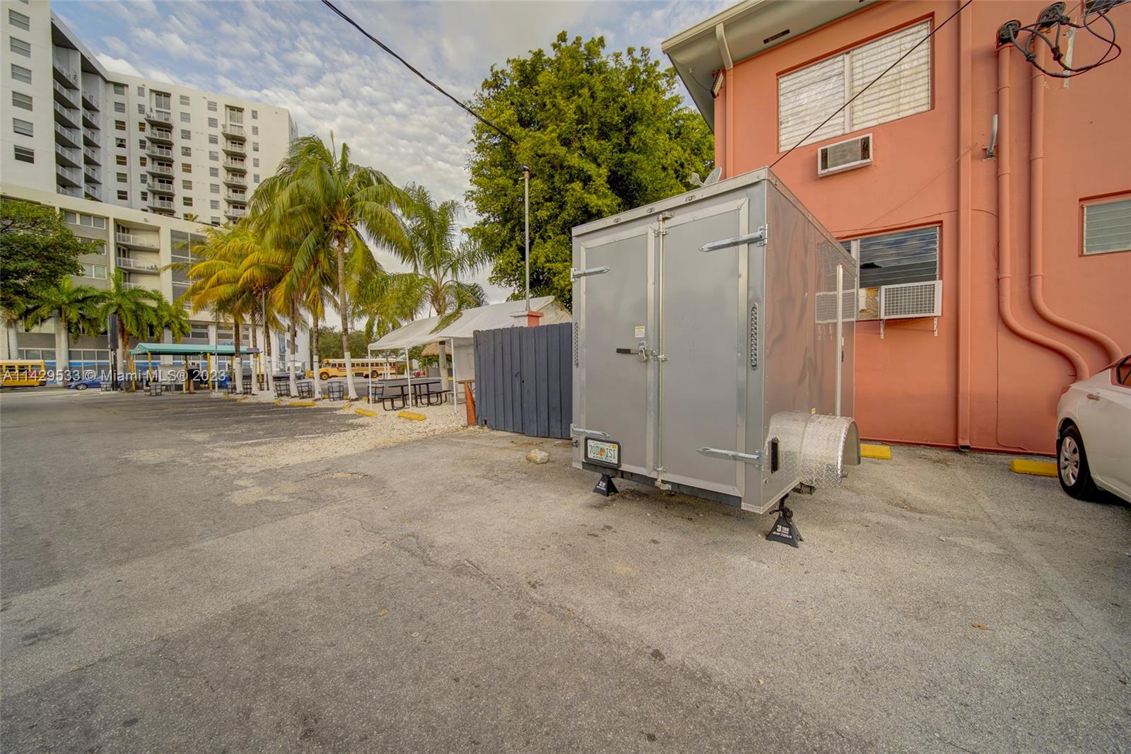 Car Wash For Sale In Miami Miami, FL 33125 - Photo 10 of 19 a view of a street with a building in the background