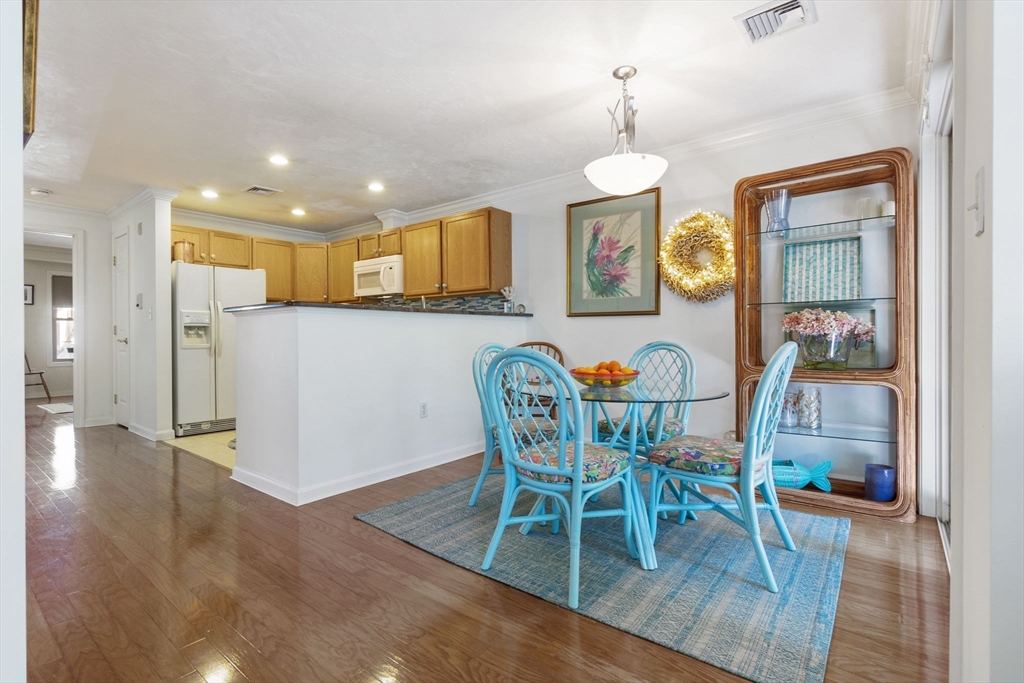35 Collins Street, Unit 75 Danvers, MA 01923 - Photo 11 of 31 a view of a dining room with furniture and wooden floor