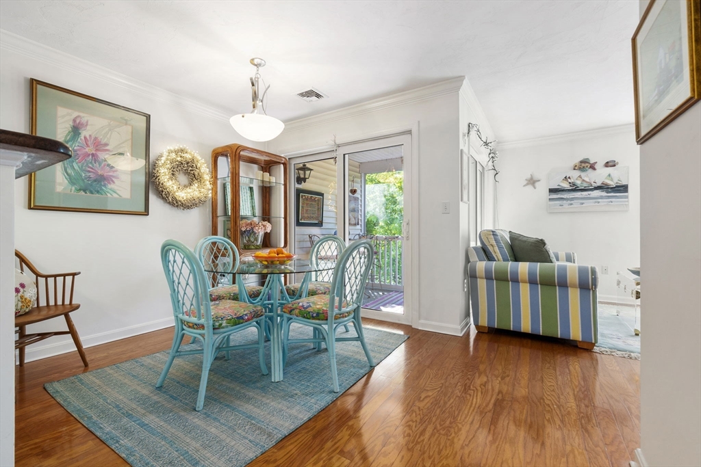 35 Collins Street, Unit 75 Danvers, MA 01923 - Photo 12 of 31 a dining room with furniture and wooden floor